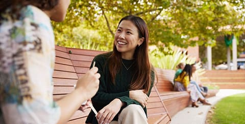 female student engaged in a conversation